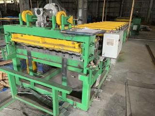 Line for the production of corrugated sheets and metal tiles